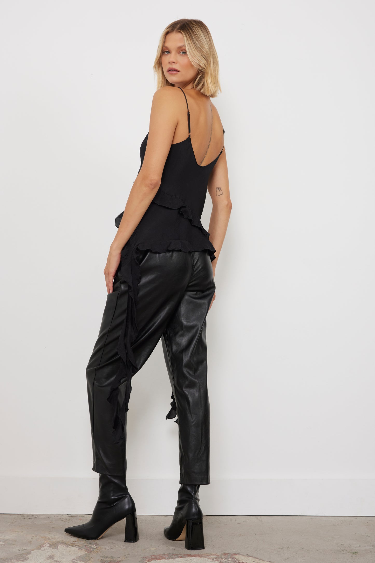 Causing A Ruffle Black Top
